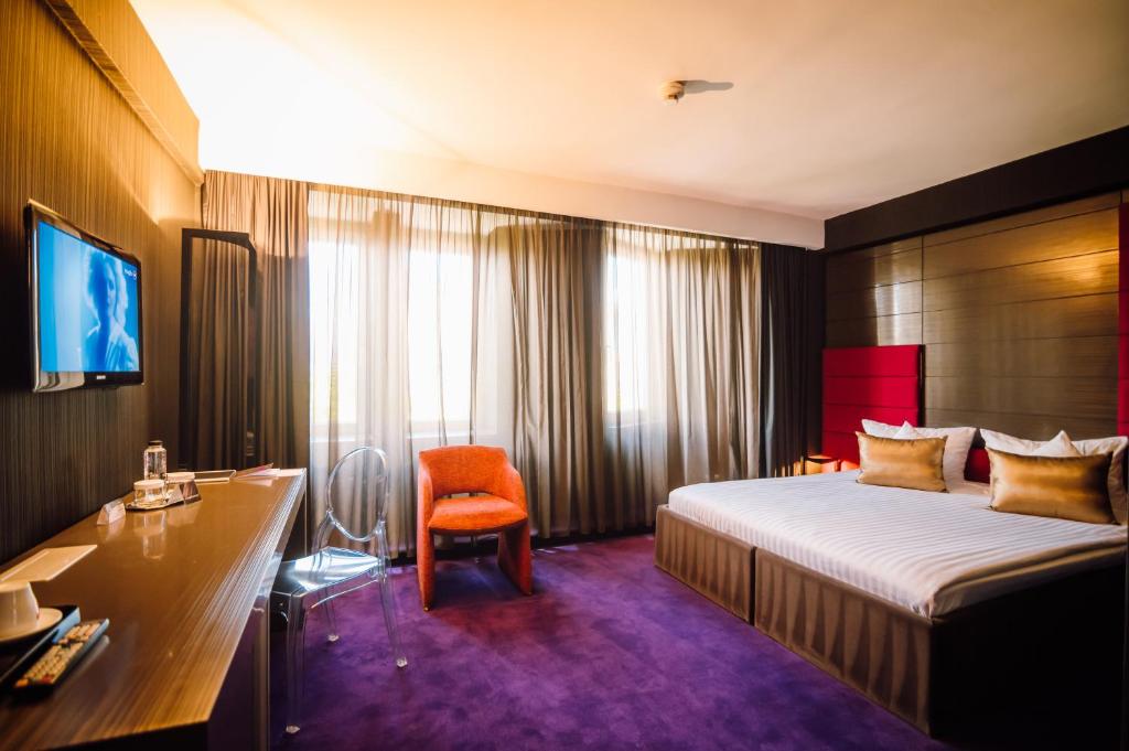 Postel nebo postele na pokoji v ubytování Plaza V Hotel