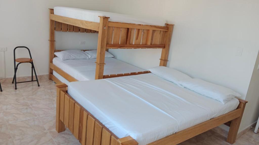 Postel nebo postele na pokoji v ubytování apartaestudios luna azul rodadero
