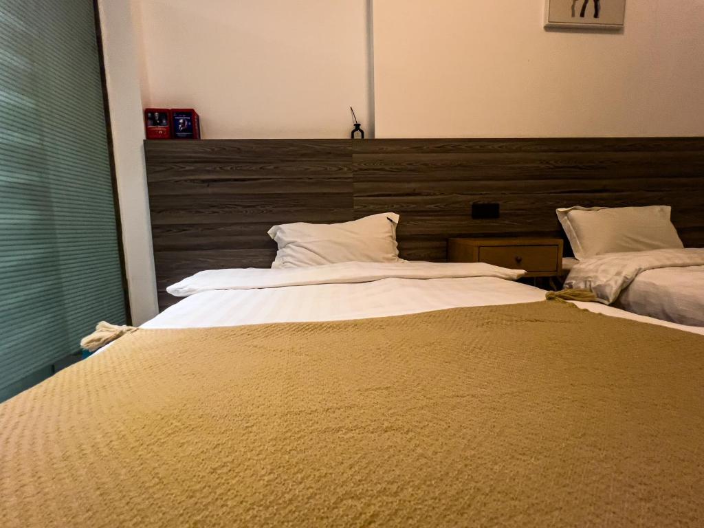 Postel nebo postele na pokoji v ubytování 客居青山