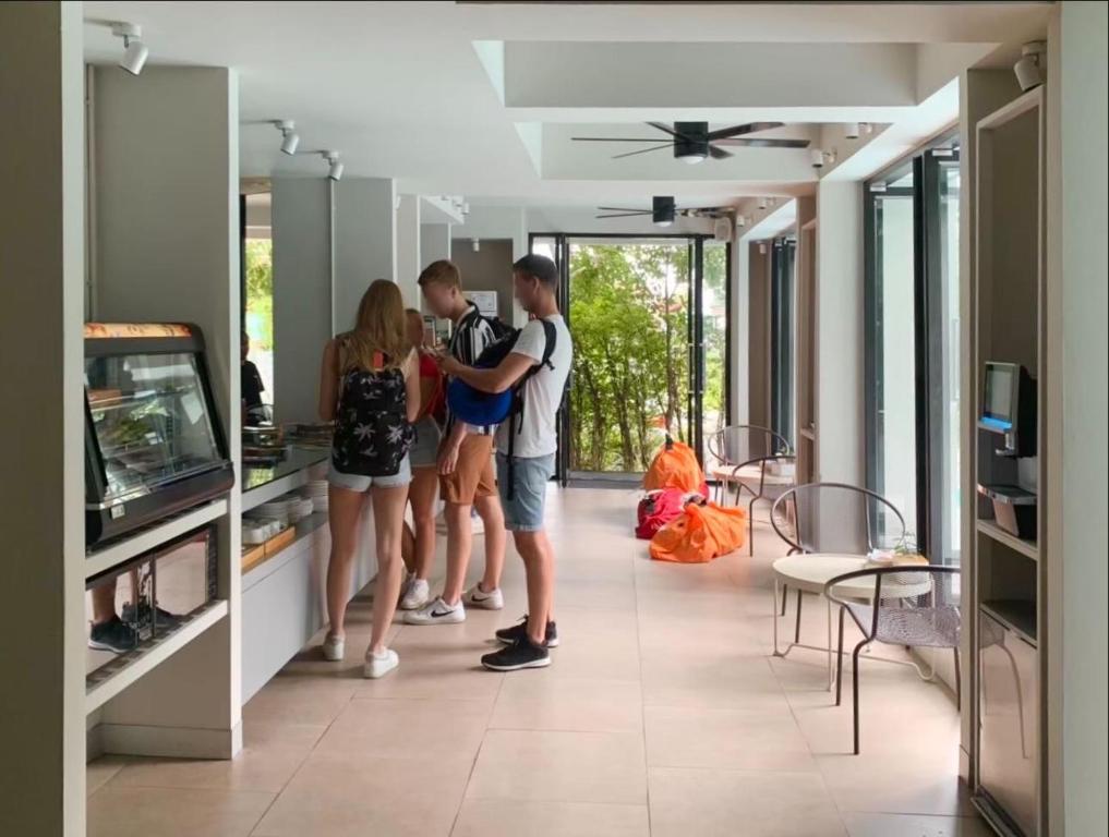 A bright open common area beside the breakfast display and floor-to-ceiling windows.
