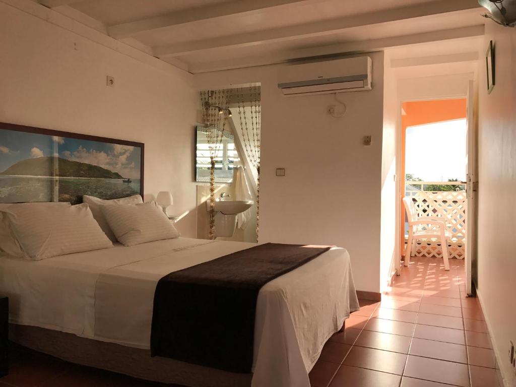 En eller flere senge i et værelse på Plage St-Anne T4 duplex