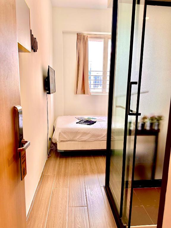 Postel nebo postele na pokoji v ubytování 木居 Woody House