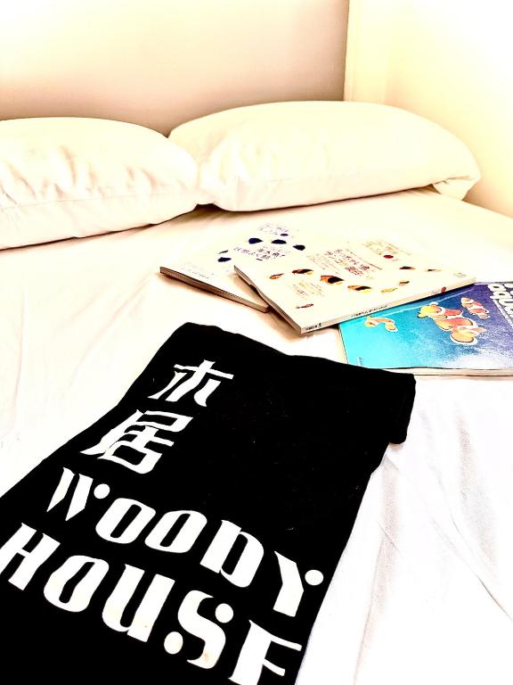 Postel nebo postele na pokoji v ubytování 木居 Woody House