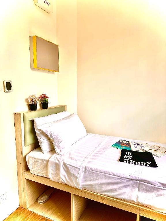 Postel nebo postele na pokoji v ubytování 木居 Woody House