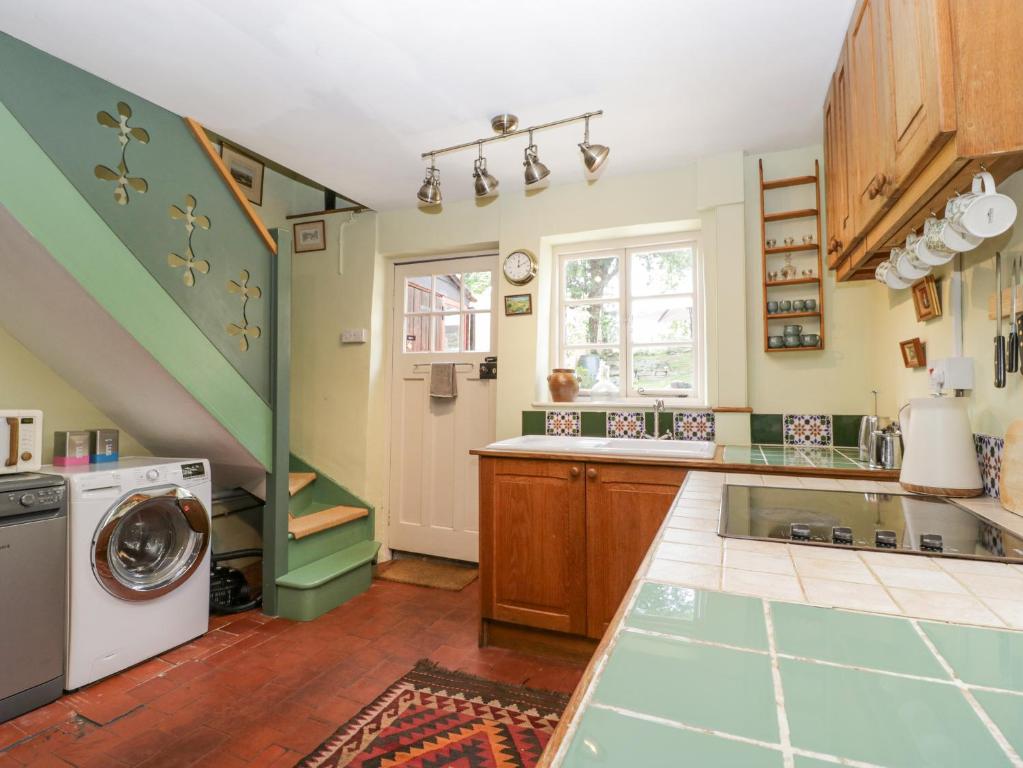 Kuchyň nebo kuchyňský kout v ubytování Stone Cottage