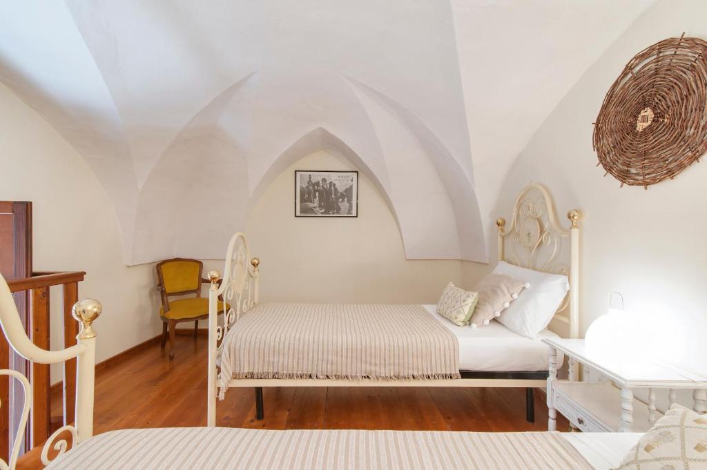 Postel nebo postele na pokoji v ubytování Casetta Rubichi Apartment