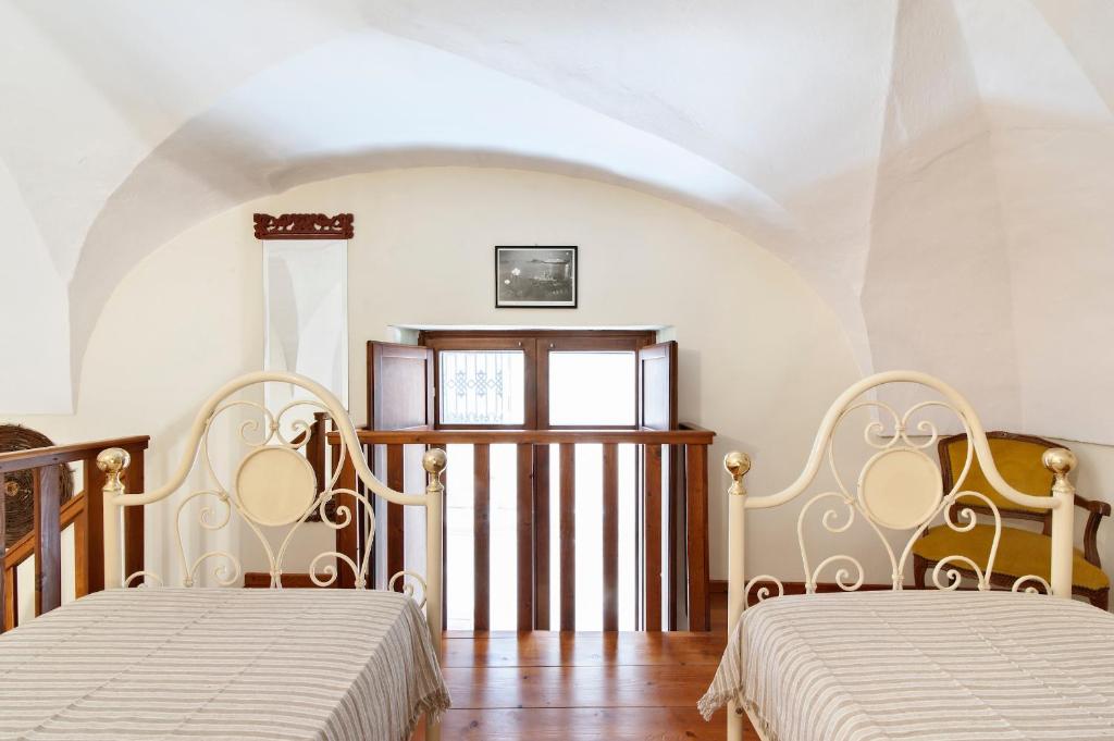 Postel nebo postele na pokoji v ubytování Casetta Rubichi Apartment