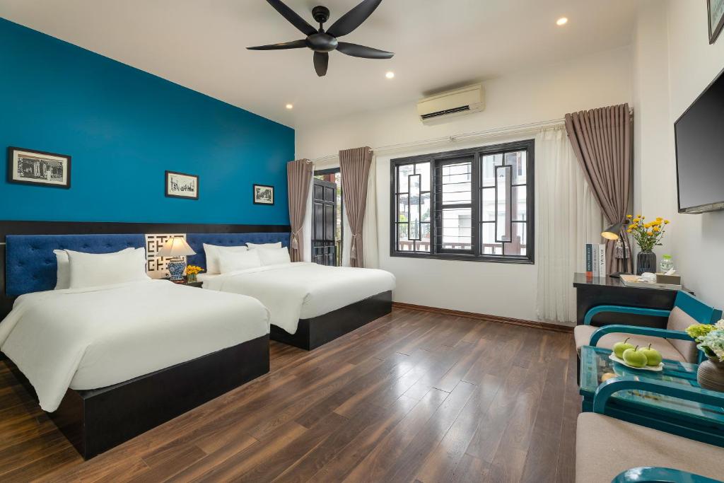 Postel nebo postele na pokoji v ubytování Hanoi Starlight Boutique Hotel