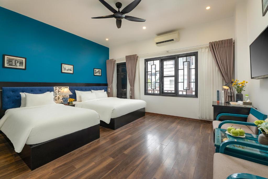 Postel nebo postele na pokoji v ubytování Hanoi Starlight Boutique Hotel