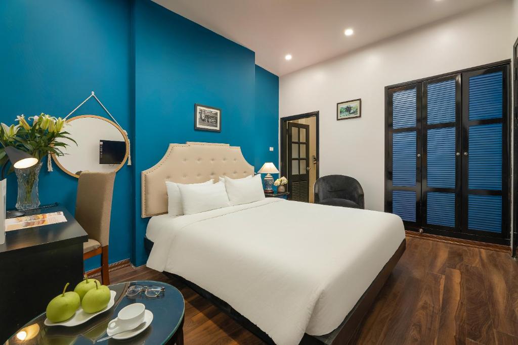 Postel nebo postele na pokoji v ubytování Hanoi Starlight Boutique Hotel