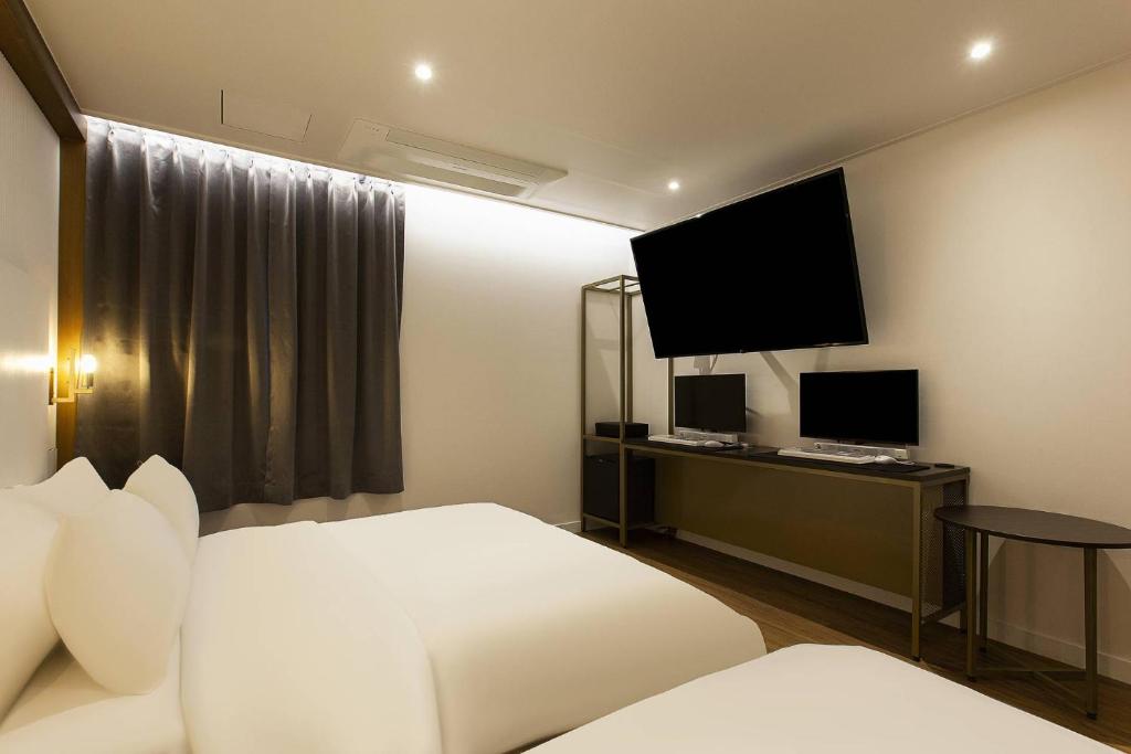 TV a/nebo společenská místnost v ubytování Grazie Hotel Tanhyeon