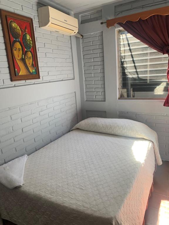 Postel nebo postele na pokoji v ubytování Managua Hotel Oasis