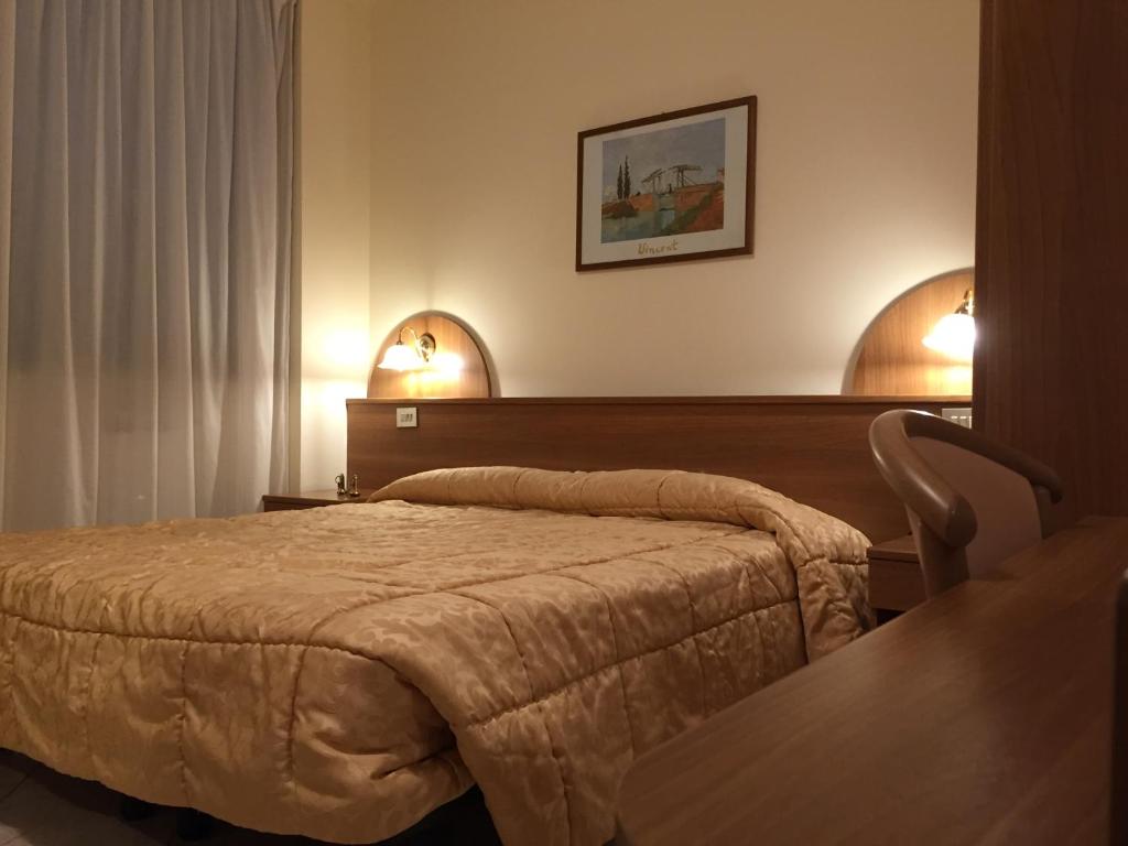Кровать или кровати в номере Hotel Rocco