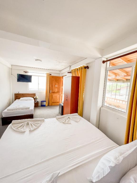 Postel nebo postele na pokoji v ubytování New Wave Beach Resort Unawatuna