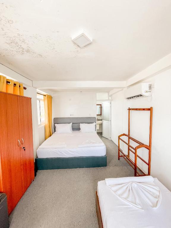 Postel nebo postele na pokoji v ubytování New Wave Beach Resort Unawatuna