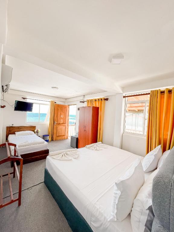 Postel nebo postele na pokoji v ubytování New Wave Beach Resort Unawatuna