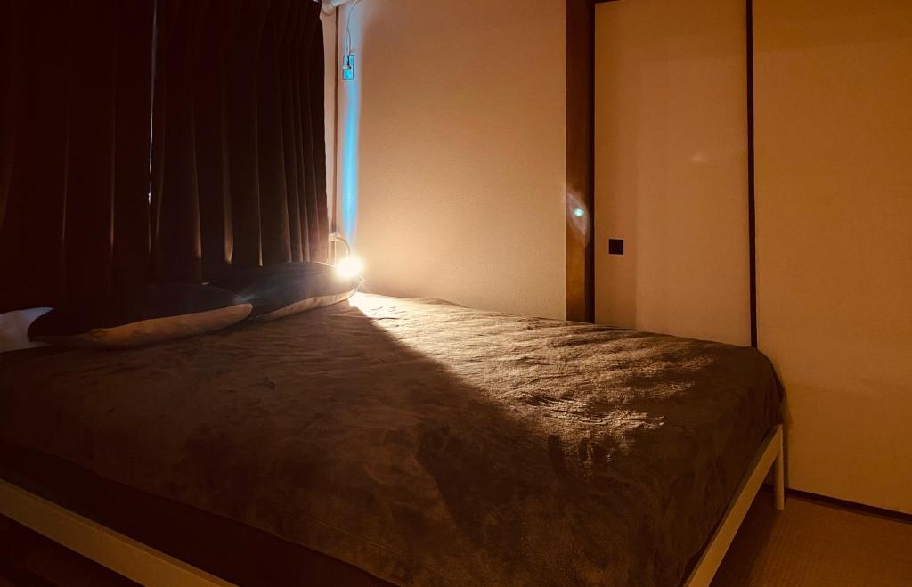 Postel nebo postele na pokoji v ubytování KOBE coffee hostel