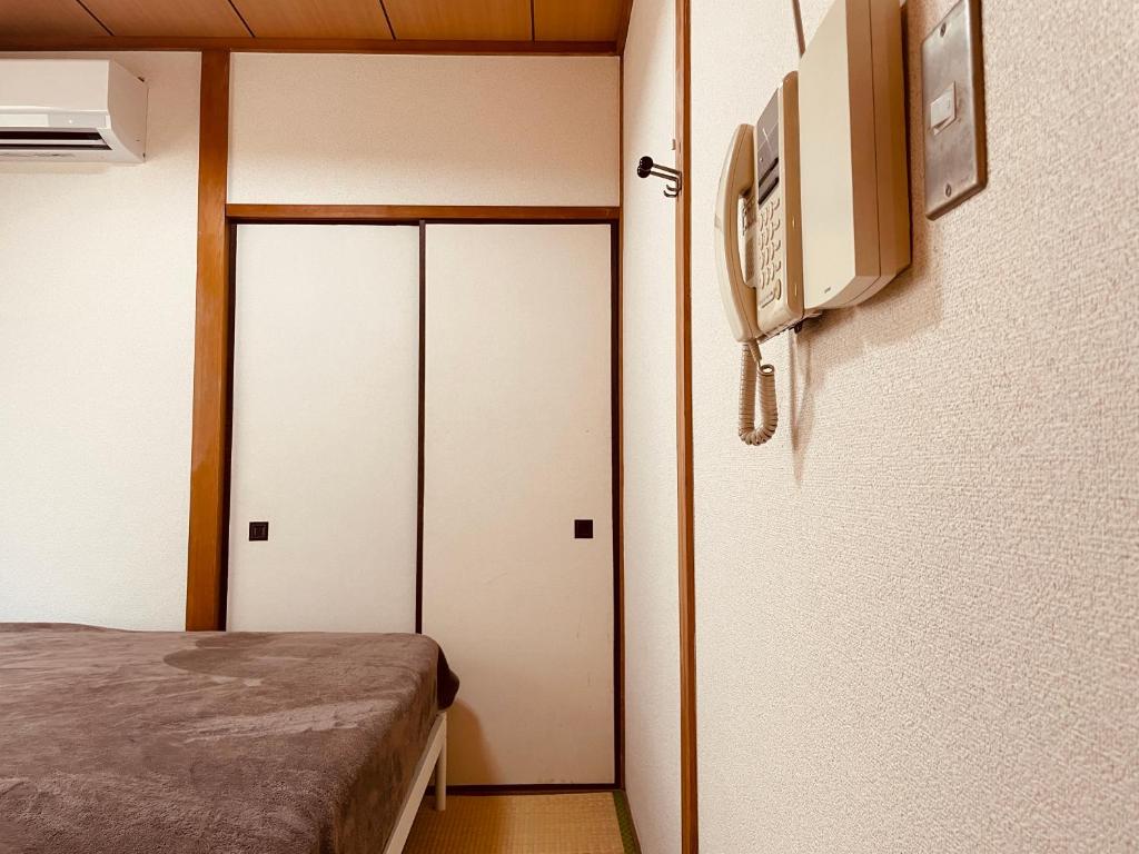 Postel nebo postele na pokoji v ubytování KOBE coffee hostel