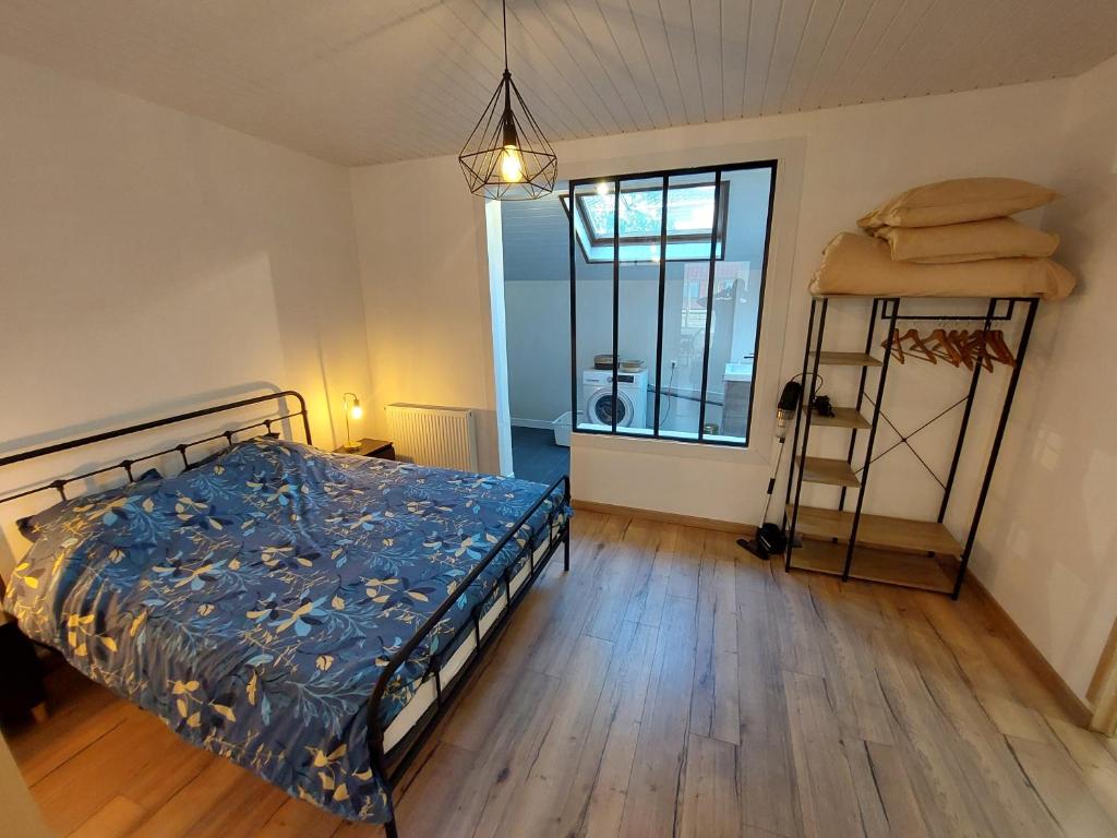 Posteľ alebo postele v izbe v ubytovaní Appartement proche des remparts