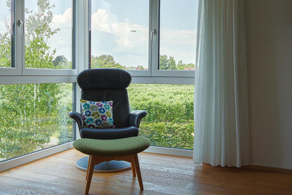 a chair sitting in front of a window at Bregenz in Bettnau