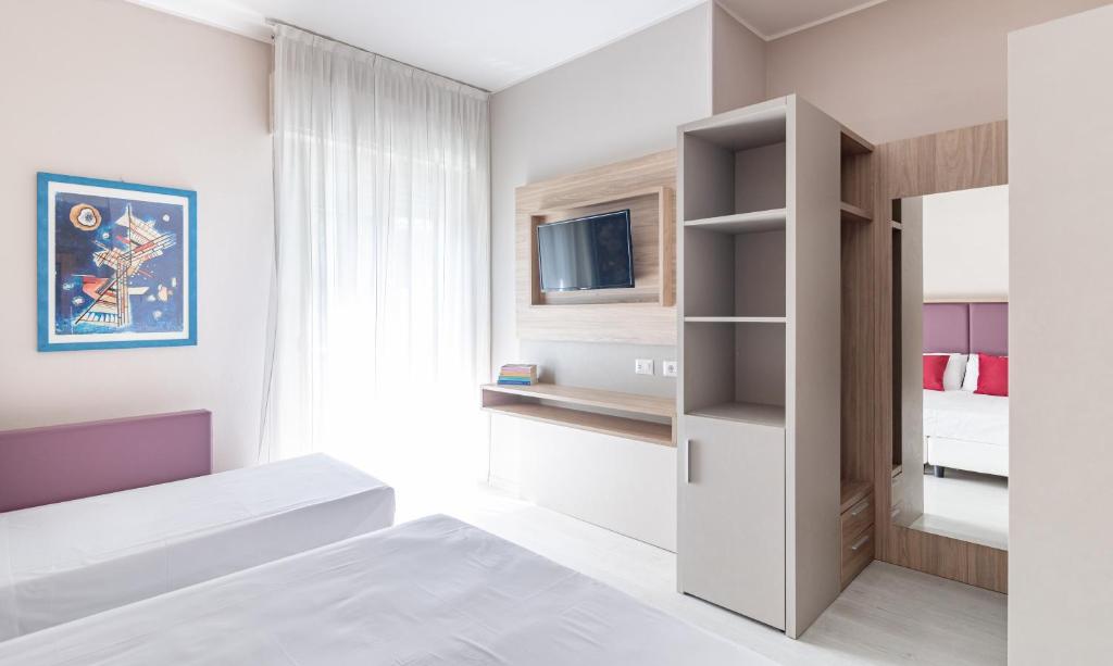 Postel nebo postele na pokoji v ubytování Hotel Biancamano