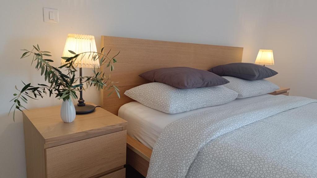 Postel nebo postele na pokoji v ubytování Villa Ulivo Apartments