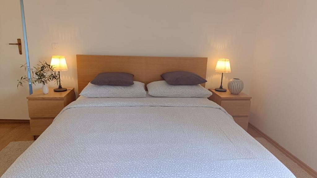 Postel nebo postele na pokoji v ubytování Villa Ulivo Apartments