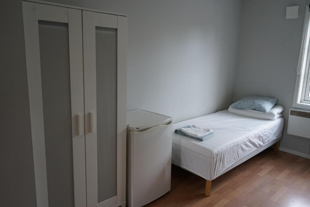 Postel nebo postele na pokoji v ubytování Home Express Oslo