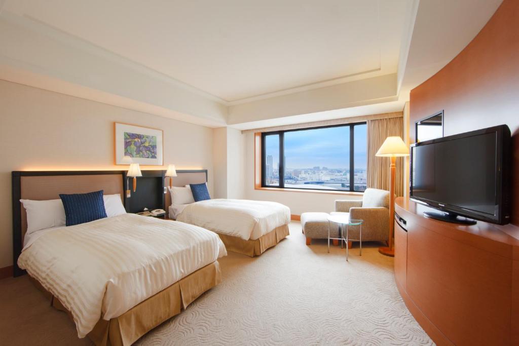 Postel nebo postele na pokoji v ubytování The Yokohama Bay Hotel Tokyu