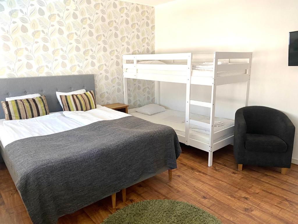 Postel nebo postele na pokoji v ubytování Hotell City