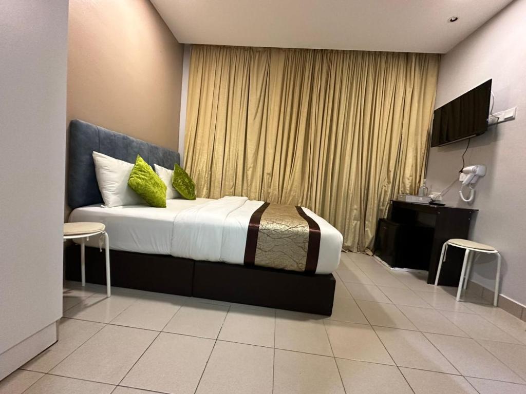 Postel nebo postele na pokoji v ubytování SS Grey Hotel 2