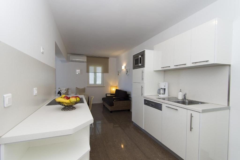 Cuisine ou kitchenette dans l'établissement Apartments Villa Olea