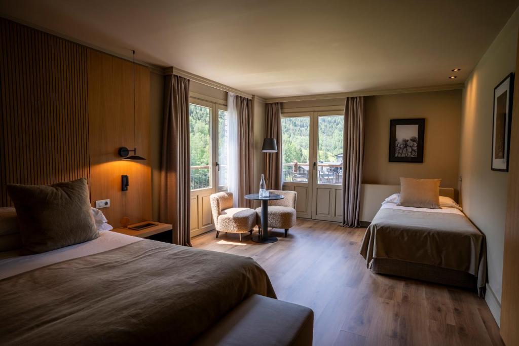 Postel nebo postele na pokoji v ubytování Serras Andorra