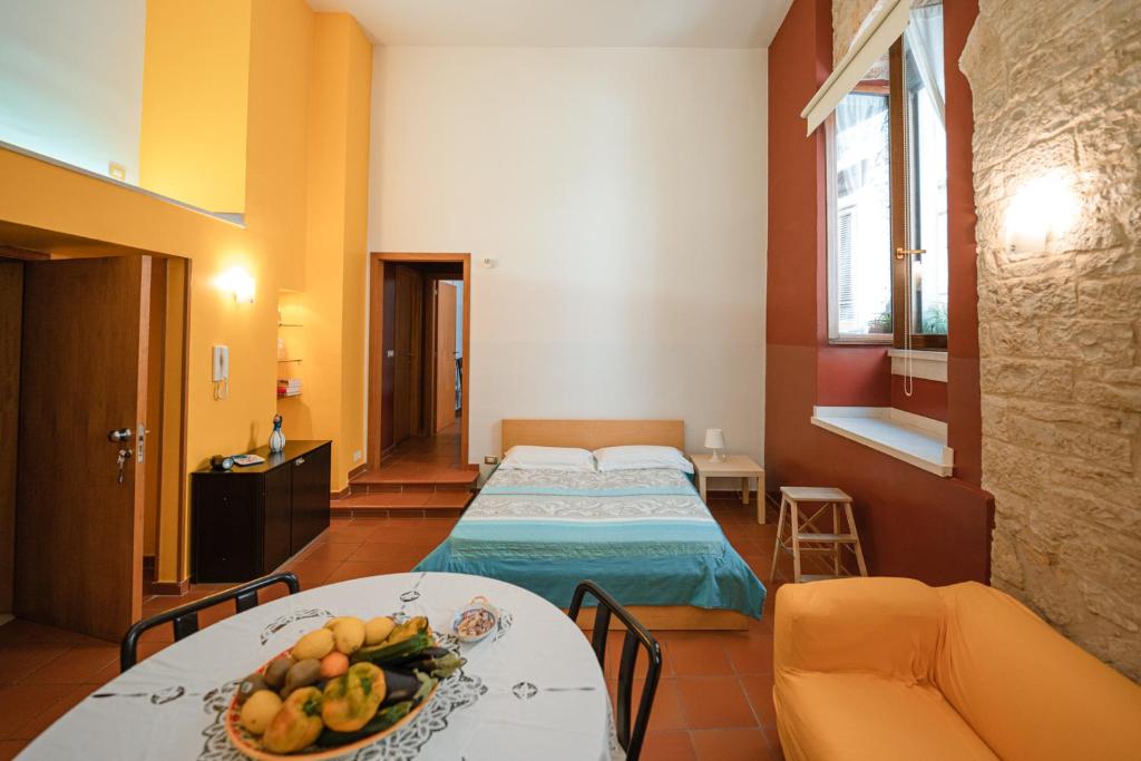 Postel nebo postele na pokoji v ubytování La Piccola Torre