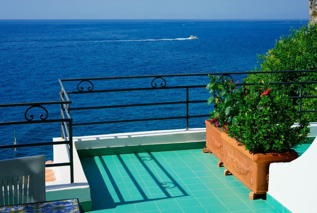 a balcony with a view of the ocean at Hotel Aurora in Amalfi