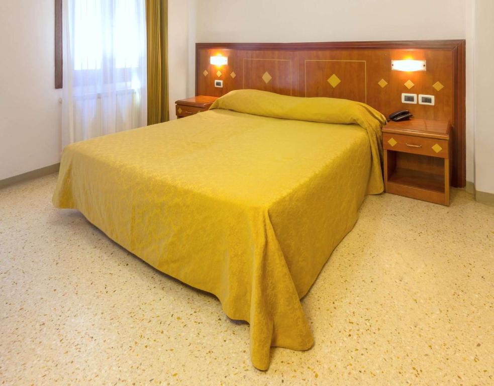 Postel nebo postele na pokoji v ubytování Hotel Adriatico