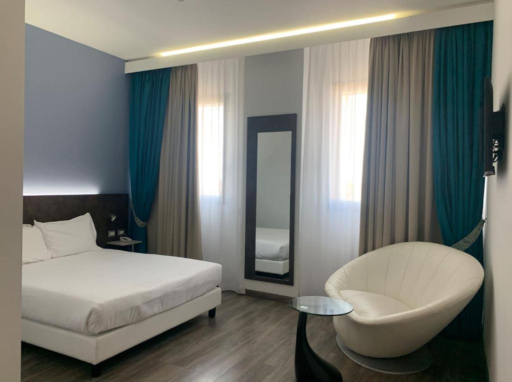 Łóżko lub łóżka w pokoju w obiekcie Phi Hotel Milano