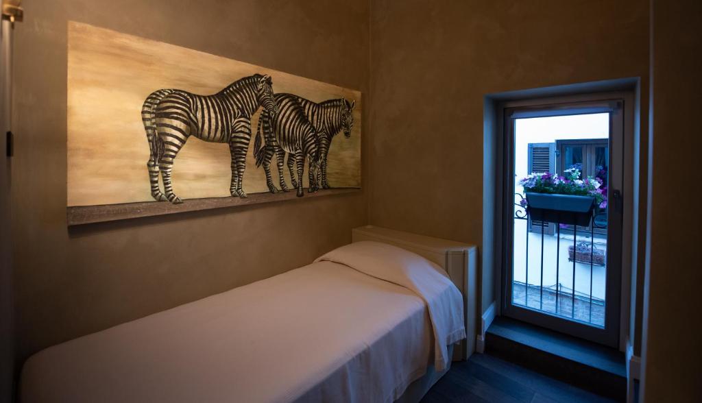 A bed or beds in a room at Casa Segreta