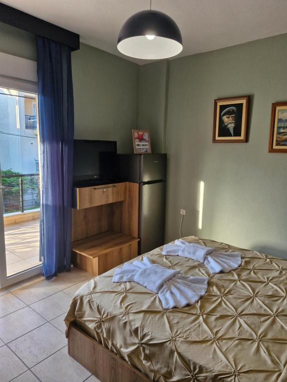 Postel nebo postele na pokoji v ubytování Julie Apartment