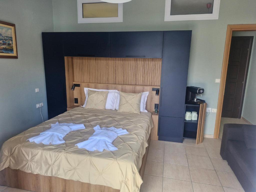 Postel nebo postele na pokoji v ubytování Julie Apartment