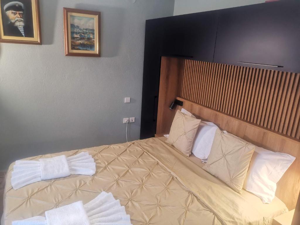 Postel nebo postele na pokoji v ubytování Julie Apartment