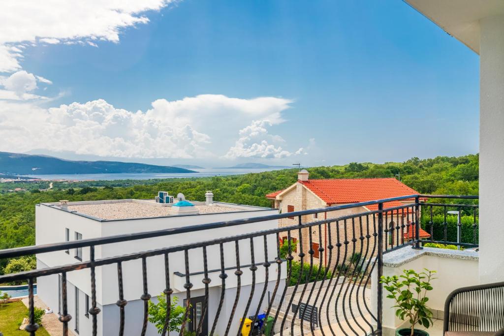 a balcony with a view of the water at PERLA VERDE Apartments in Krk
