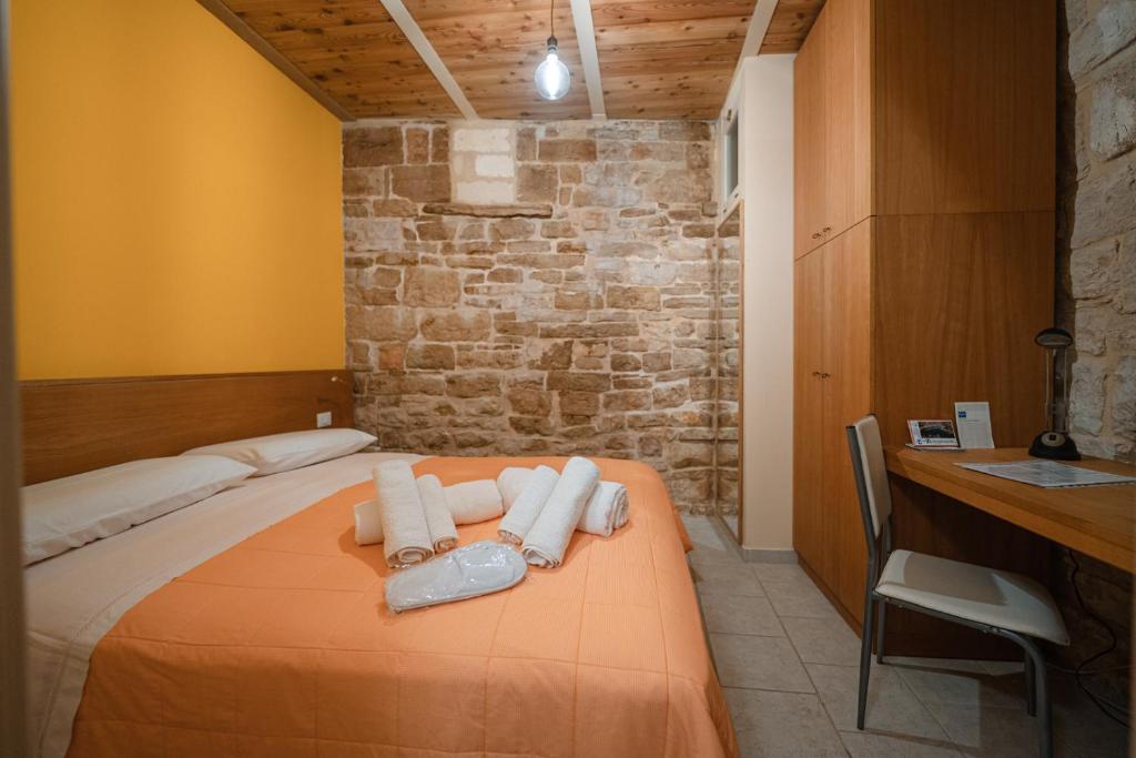 Postel nebo postele na pokoji v ubytování La Piccola Torre