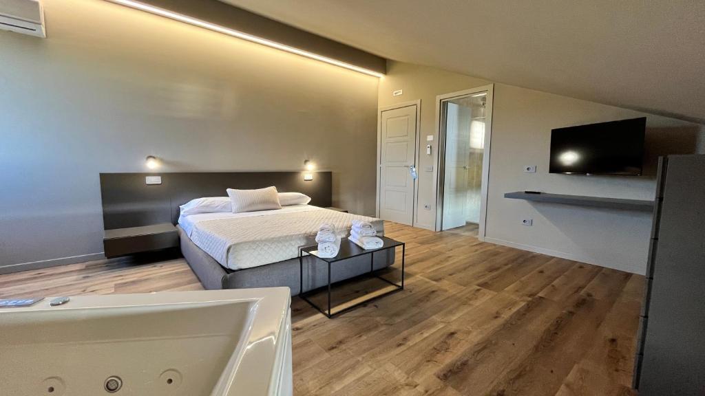 TV a/nebo společenská místnost v ubytování Assisium Agriturismo
