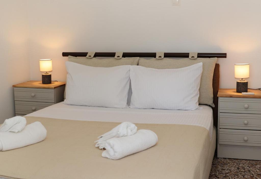 Postel nebo postele na pokoji v ubytování Aira Apartments