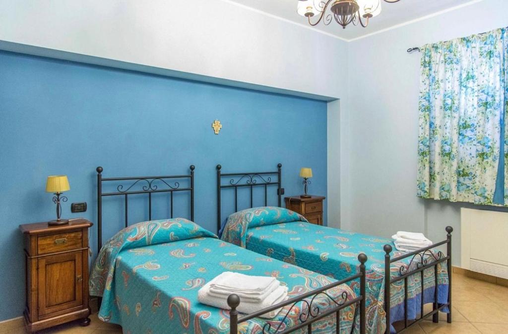 Postel nebo postele na pokoji v ubytování B&b Sant'Andrea
