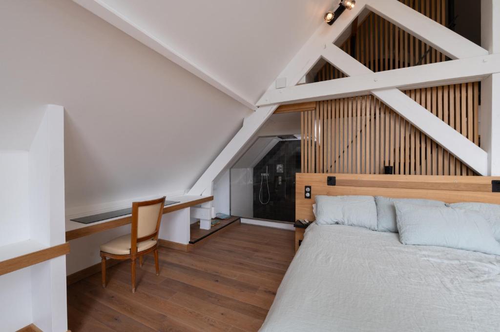 Postel nebo postele na pokoji v ubytování Suite Cathédrale - Ty Castel