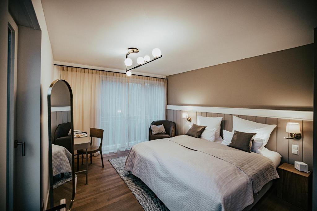 Postel nebo postele na pokoji v ubytování Landgasthof Jagstmühle