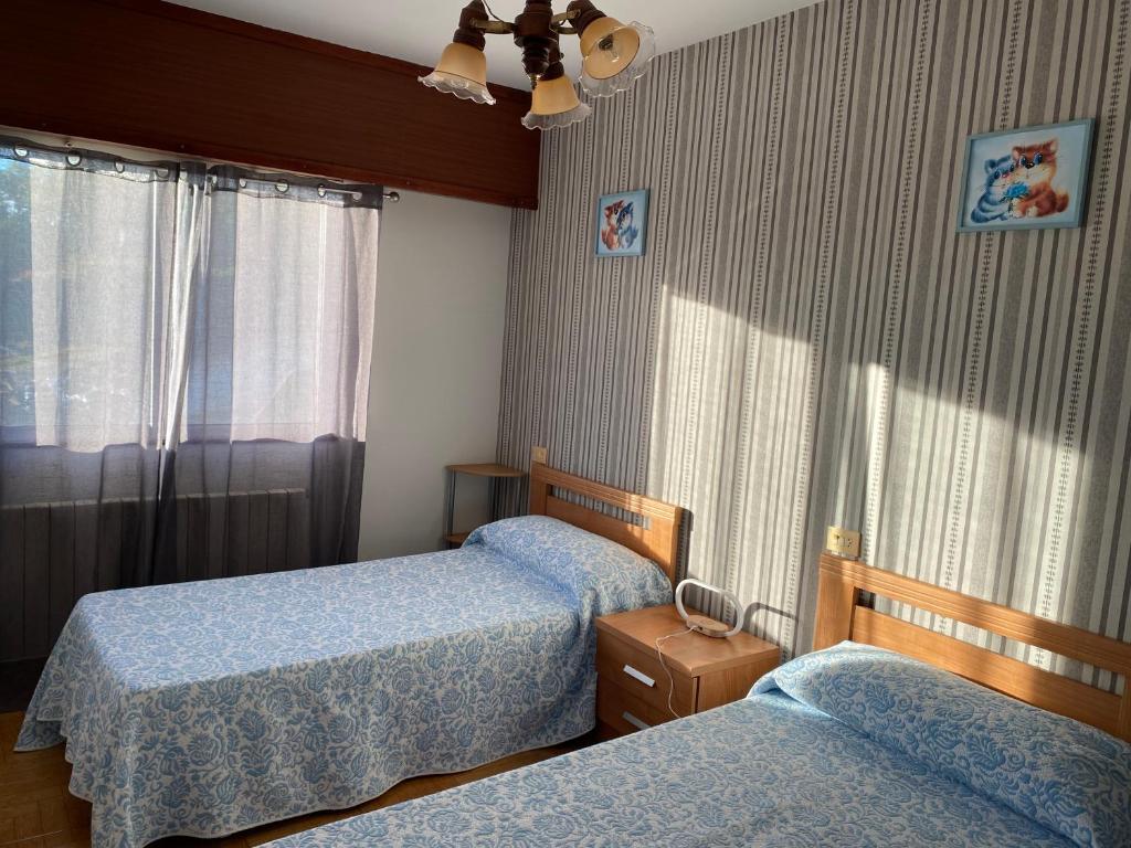 A bed or beds in a room at Casa Portomeiro