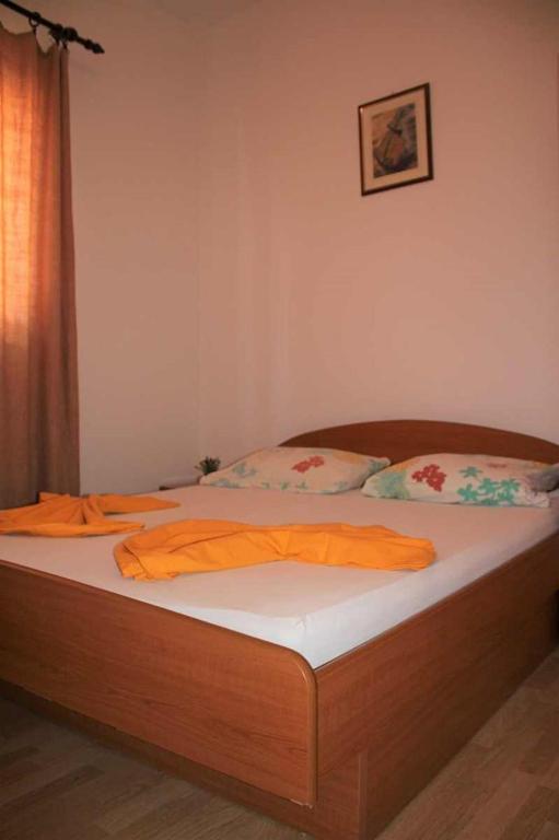 Postel nebo postele na pokoji v ubytování Apartments Pidi